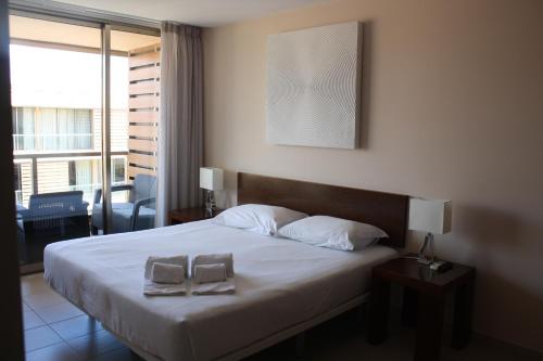 Кровать или кровати в номере Herdade dos Salgados