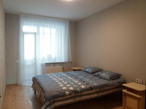 Postel nebo postele na pokoji v ubytování 2-х кім. кв. по вул. Кн. Ольги, р-н Вікторія Гарден.
