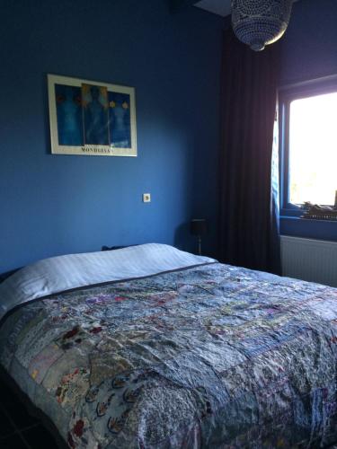 Postel nebo postele na pokoji v ubytování Vakantiewoning De Lotus