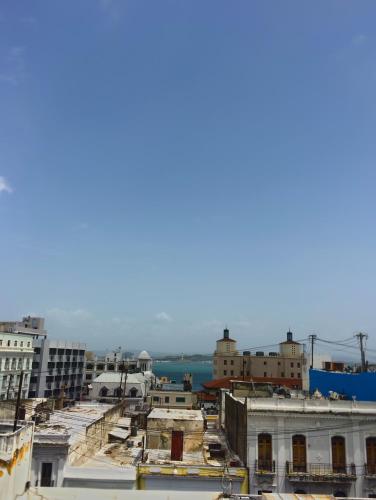 a view of a city with buildings and the water at Navona Studios in San Juan