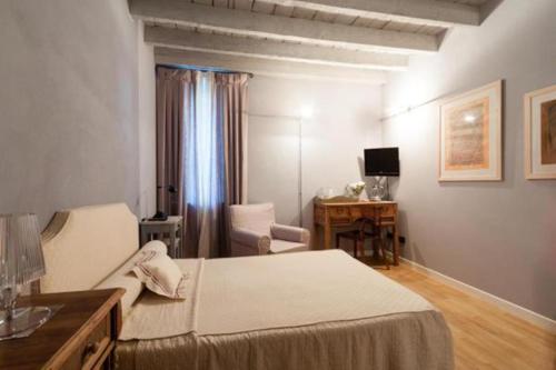 Postel nebo postele na pokoji v ubytování B&B a Ca' Minore Franciacorta