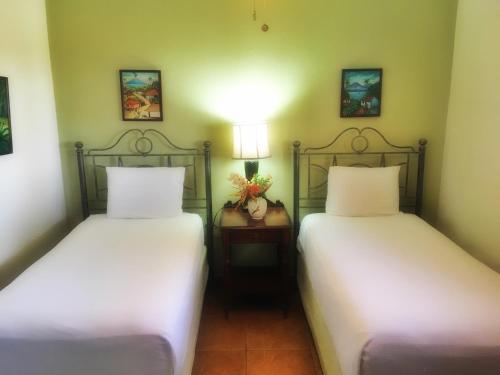 two beds sitting next to each other in a room at Suite San Juan 133 Gran Pacifica Resort in San Diego