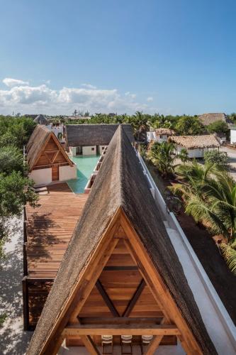 an attic view of a house with a wooden roof at Hotel Boutique Punta Caliza - Adults Oriented in Holbox Island