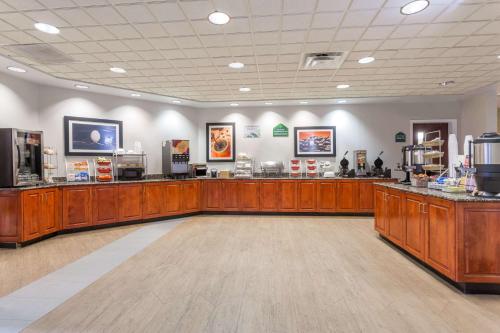 a store with wooden counters in a large room at Wingate by Wyndham Chesapeake in Chesapeake