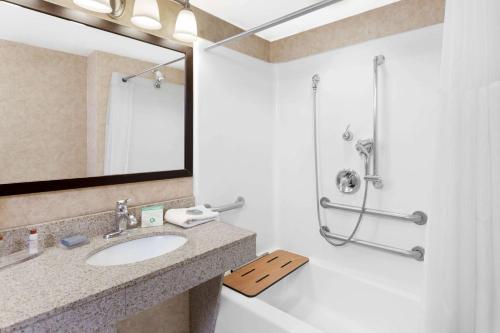 a bathroom with a sink and a shower at Wingate by Wyndham Yuma in Yuma