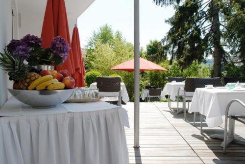 a table with a bowl of fruit on top of it at Gästehaus Schlegel in Stetten