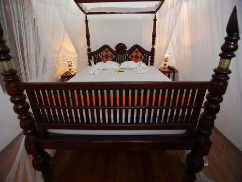Ένα ή περισσότερα κρεβάτια σε δωμάτιο στο The Villa Hotel