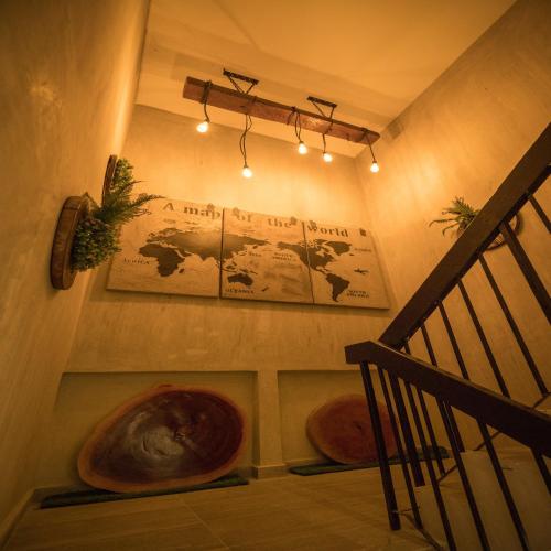 a staircase with two ottomans in a room at My Sj Hotel in Subang Jaya