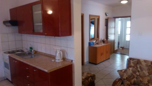 a kitchen with a sink and a counter top at Lubin in Sevid