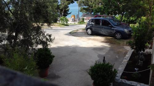 a minivan parked in a driveway in a house at Summerhouse Duće Omiš in Duće