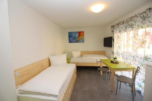 Postel nebo postele na pokoji v ubytování Gita´s Haus