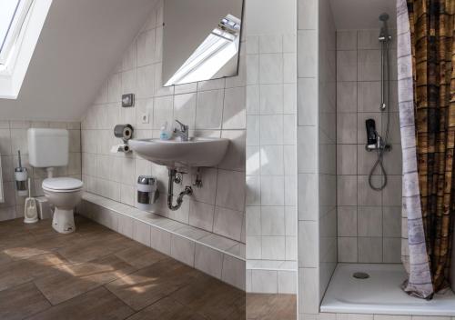 a bathroom with a sink and a toilet at BoardingHouse Quickborn in Quickborn