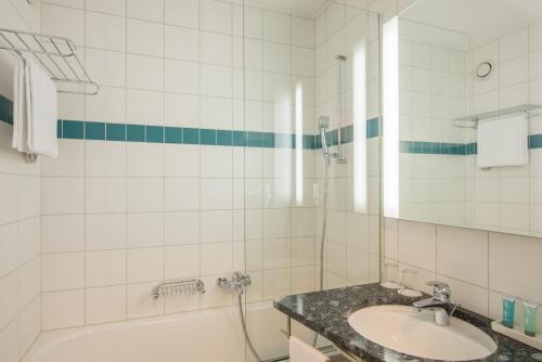 Een badkamer bij HOTEL illuster - Urban & Local