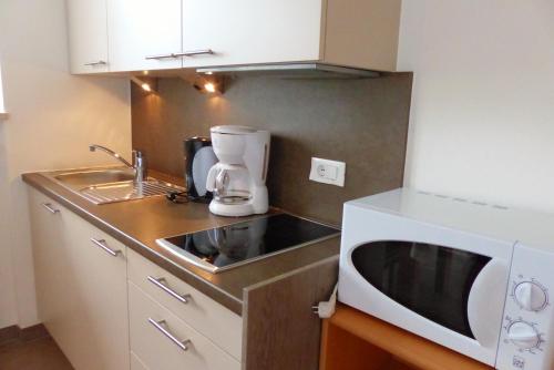 Η κουζίνα ή μικρή κουζίνα στο Residence Liesy