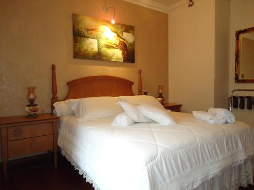 Hotel Pousada Florençaにあるベッド