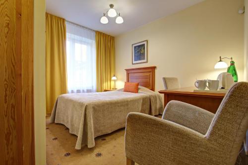 Voodi või voodid majutusasutuse Hestia Hotel Draugi toas