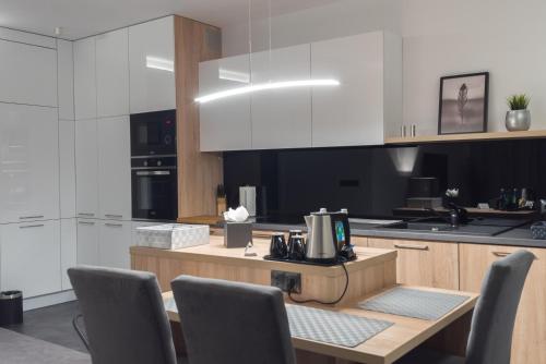 Kuchyň nebo kuchyňský kout v ubytování Apart-Hotel VIVI RESIDENCE & SPA