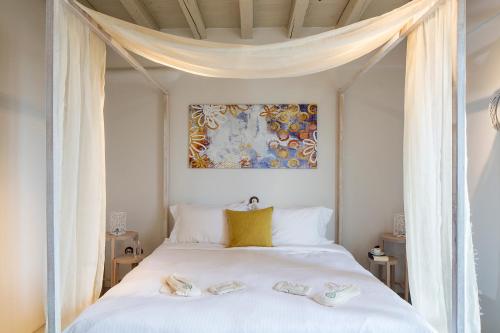 Ένα ή περισσότερα κρεβάτια σε δωμάτιο στο Melograno Villas