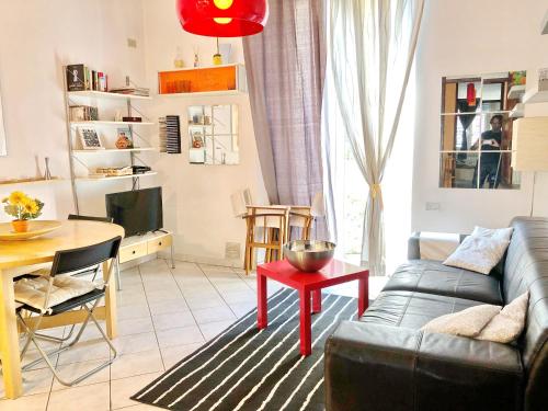 a living room with a couch and a table at Apartment With Garden in Lucca
