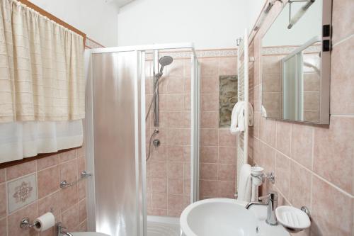 a bathroom with a shower and a sink and a toilet at Osteria I'Casolare in San Giovanni Valdarno