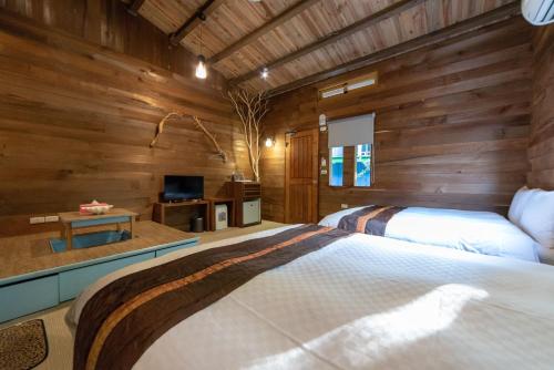 Postel nebo postele na pokoji v ubytování Shankou Hotspring Hotel