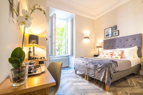 Posteľ alebo postele v izbe v ubytovaní Eccelso Hotel