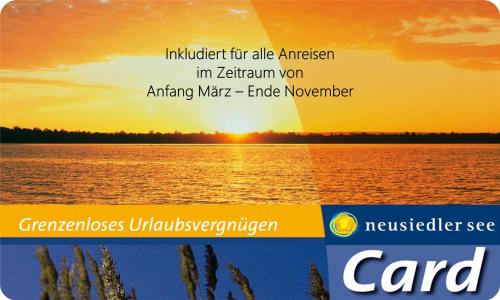 an image of the sun setting over the water at Wein & Landhaus Willi Opitz in Illmitz