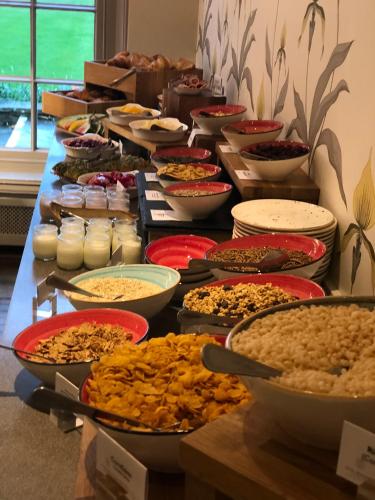a table full of bowls and plates of food at Royal Berkshire in Ascot