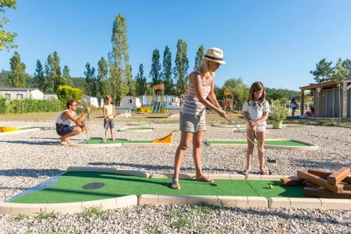 a group of people playing a game of trampoline at Camping Officiel Siblu Les Rives de Condrieu in Condrieu