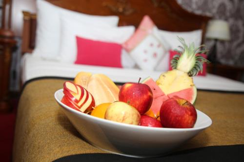 a bowl of fruit on a table in a hotel room at Hotel East Lagoon in Batticaloa