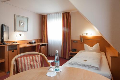 Postel nebo postele na pokoji v ubytování Hotel - Restaurant Hirsch