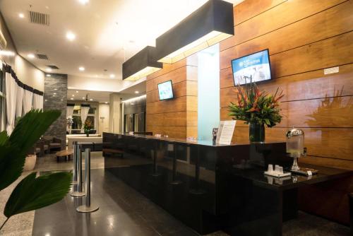 TV a/nebo společenská místnost v ubytování Plaza Rio Residences - Barra First