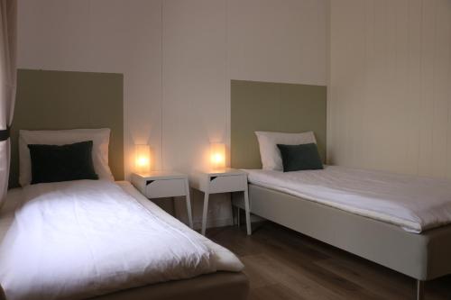 Un pat sau paturi într-o cameră la Valldal Gjestgiveri