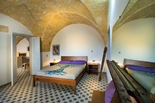 Postel nebo postele na pokoji v ubytování Masseria Prontera with Pool