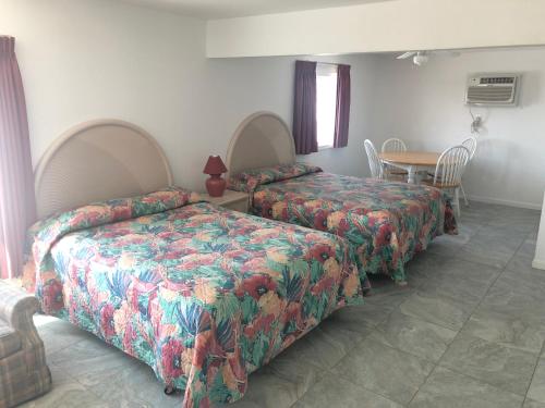 Säng eller sängar i ett rum på Apollo Motel