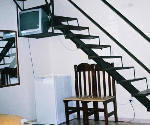 Hotel Portal de Barequeçabaにあるテレビまたはエンターテインメントセンター