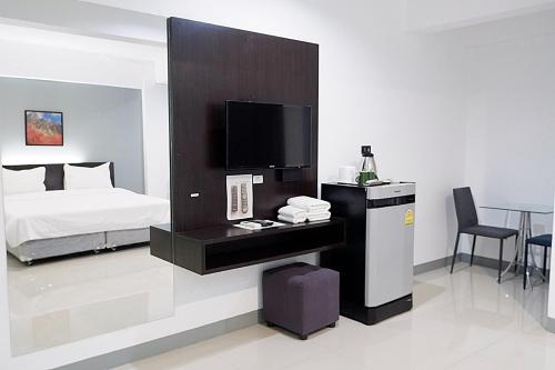 Postel nebo postele na pokoji v ubytování Izen Budget Hotel & Residence