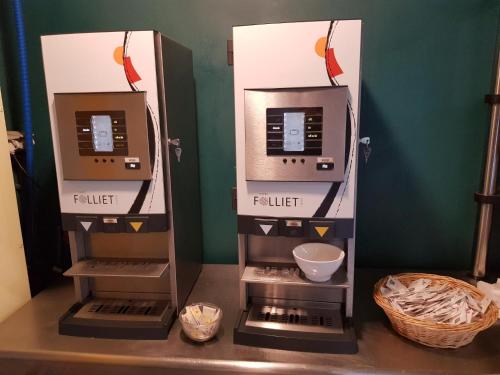a kitchen with a coffee machine on a counter at ETHIC ETAPES DIJON Accueil 24h24 et parking gratuit in Dijon