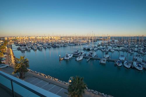 a marina filled with lots of boats in the water at Suites Puerto Sherry in El Puerto de Santa María
