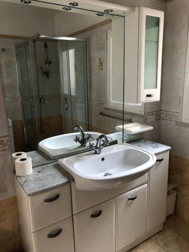 a bathroom with a sink and a mirror at Casa GARY in Ponza