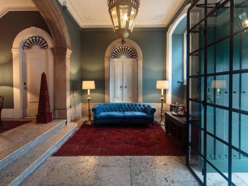 a large room with a large bed and a large mirror at Dear Lisbon - Bordalo Palace Chiado in Lisbon
