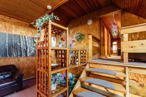 a interior of a wooden cabin with stairs in it at Homestay Gustav Halas in Terchová
