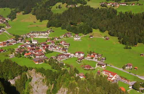 an aerial view of a house on a hill at Haus am Sonnenhang in Finkenberg