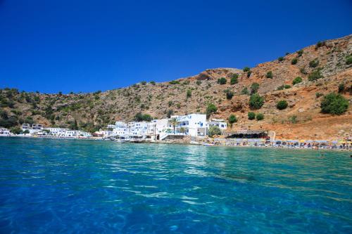 a view of a beach from the water at Molos Apartments in Loutro