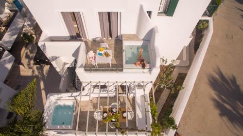 an overhead view of a house with a swimming pool at Spiros in Naxos Chora