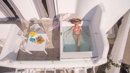 a doll in a bath tub in a house at Spiros in Naxos Chora