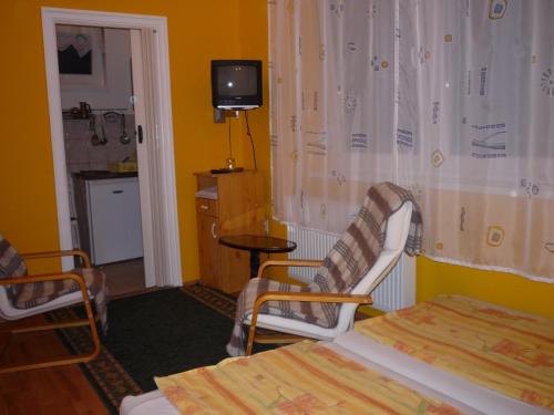 Postel nebo postele na pokoji v ubytování ABBA Gyula apartman