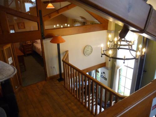 an overhead view of a staircase in a house with a clock at Crotlieve Barn in Rostrevor