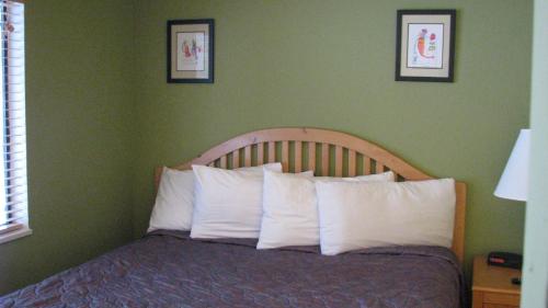 a bedroom with a bed with white pillows at Big Pines Mountain House in South Lake Tahoe