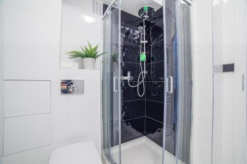 Kúpeľňa v ubytovaní Apartments Madelaine Warsaw by Noclegi Renters